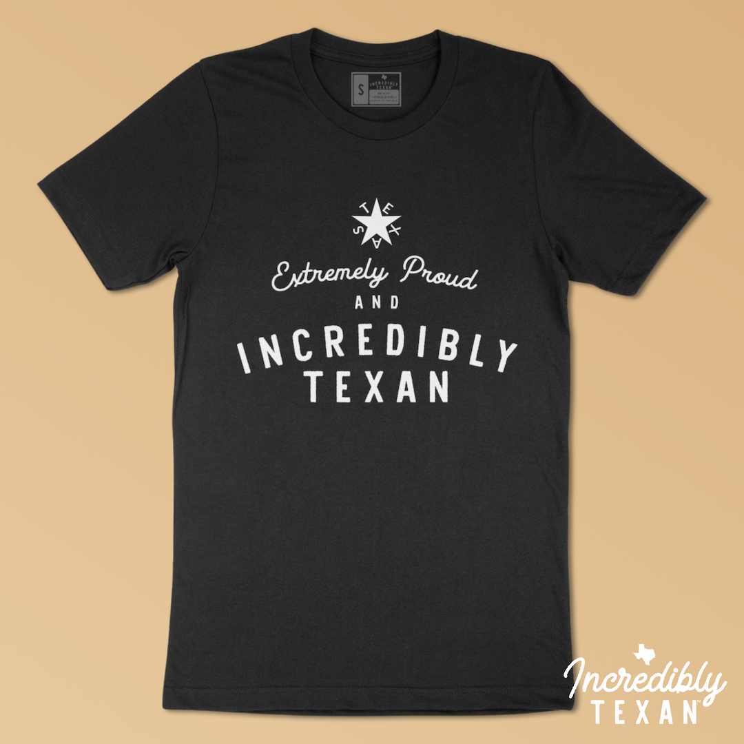 A black short sleeve t-shirt that says "Extremely Proud & Incredibly Texan" printed in white with the Zavala Texas star above.